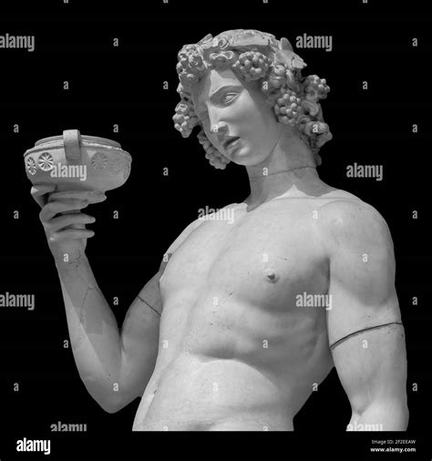 Ancient Statue Of Dionysus Isolated On A Black Background Dionysus Is