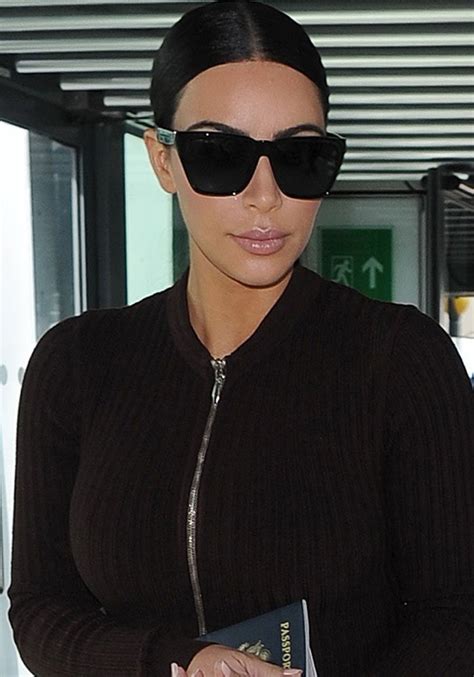 Kim Kardashian Sports Givenchy Sunglasses And Yeezy Boots At Heathrow