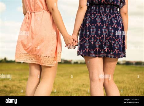 Two Women Hand In Hand Hi Res Stock Photography And Images Alamy