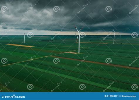 Aerial View Of Wind Turbines On Renewable Green Energy Wind Farm Stock