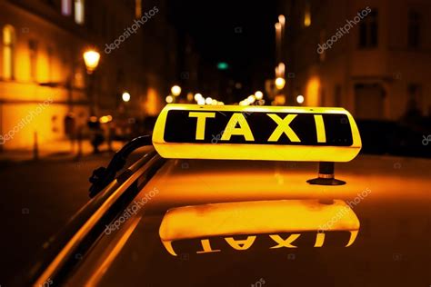 Taxi Sign On The Roof Of A Taxi — Stock Photo © Madrabothair 111248584