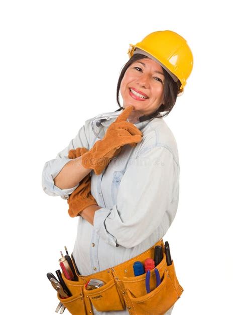 Hispanic Female Contractor Holding Level Wearing Hard Hat Isolated On