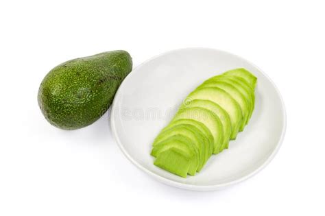 Frutos De Abacado Verde Fatiado Em Pires E Abacado Inteiro Foto De