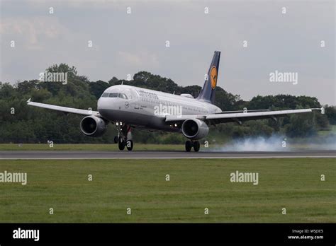 A Lufthansa Airbus A320-200 lands at Manchester International Airport ...