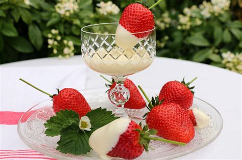 Strawberries In Melted White Chocolate Crumbs On The Table