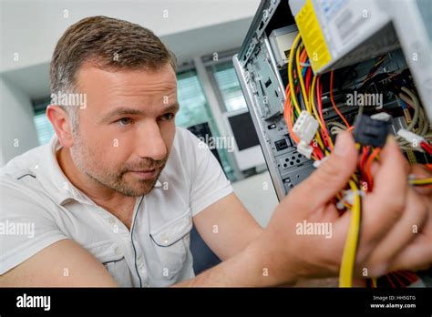 Trying To Fix His Computer Stock Photo Alamy