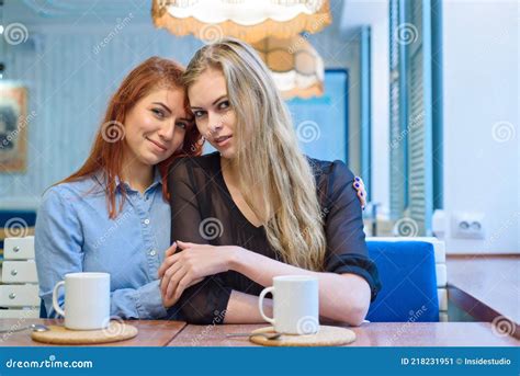 Same Sex Relationships Happy Lesbian Couple Sitting In A Cafe Girls