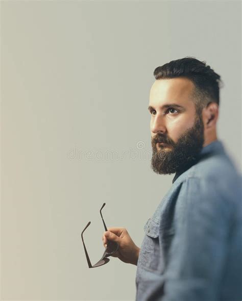 Portrait Of A Bearded Man In A Suit On A Light Background Stock Image