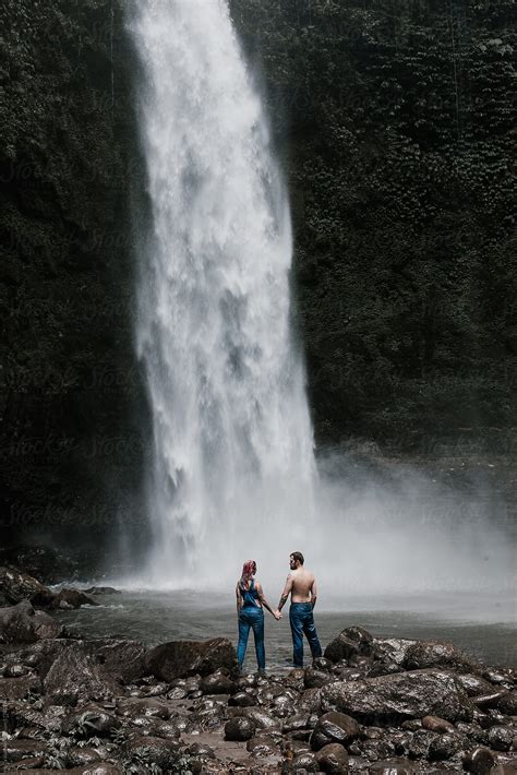 Couple Near Waterfall In Bali By Stocksy Contributor Julia Volk