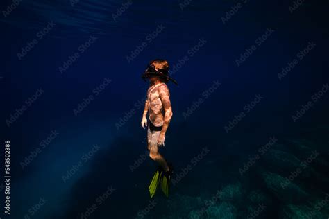 Side View Of Teenage Shirtless Boy In Flippers And Snorkeling Mask