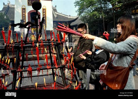 Xindu China Faithful Buddhist Visitors Light Incense At A Hexagonal