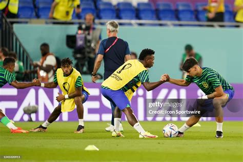 Players of Brazil warm up the FIFA World Cup Qatar 2022 group G match ...