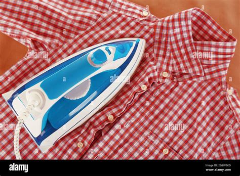 Iron And Shirt On Board Close Up Stock Photo Alamy