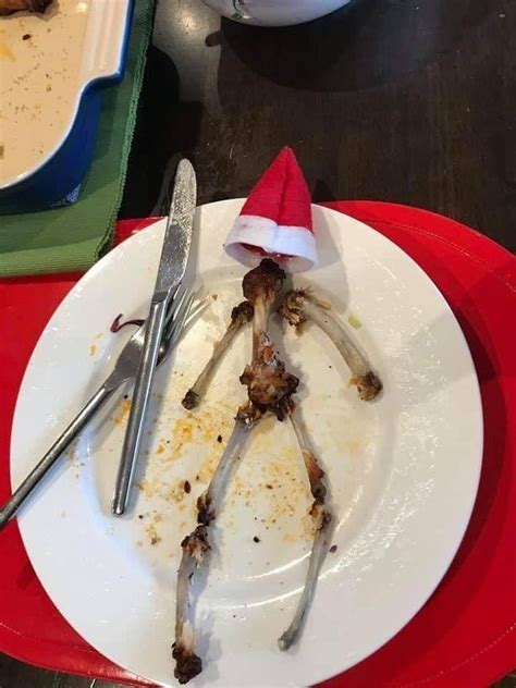 A White Plate Topped With Food On Top Of A Red Tray Next To Silverware