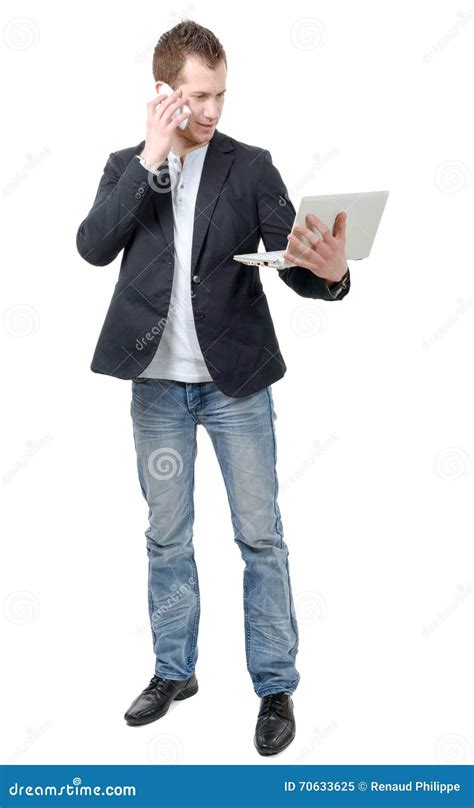 Young Man Standing With Laptop And Phone Stock Image Image Of Holding