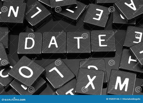 Black Letter Tiles Spelling The Word X Date X Stock Photo