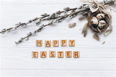 Easter Background With Quail Eggs And Pussy Willow Branch In Nest On White Wooden Background