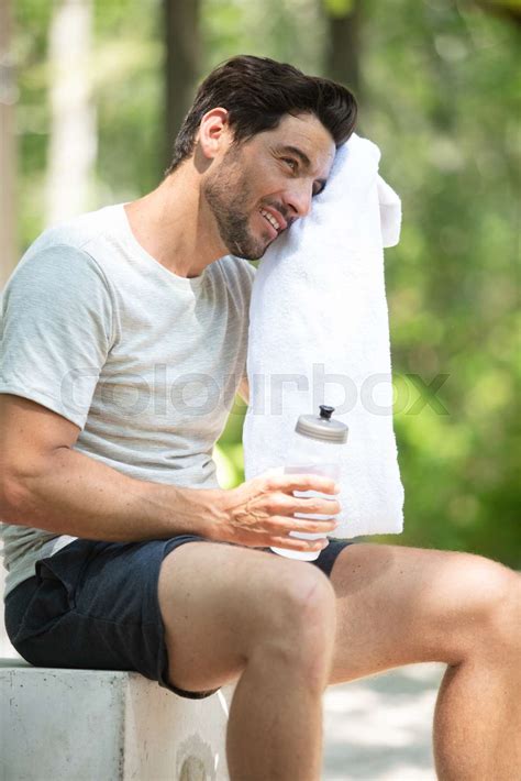 Man Drinking Water And Cooling Off After A Run Stock Image Colourbox