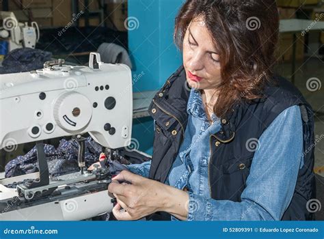 Industrial Sewing Machines With Sewing Machine Operator Stock Image