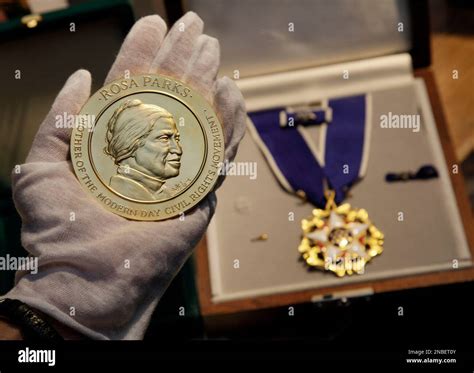 In this July 25, 2011 photo, the Congressional Gold Medal, left, and ...