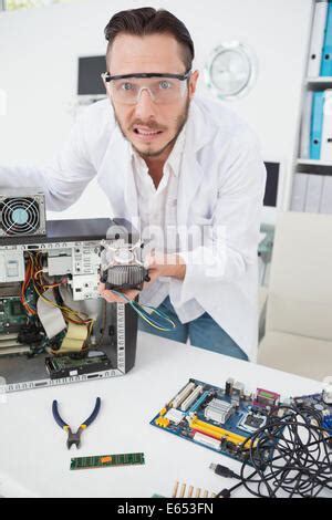 Confused Computer Engineer Looking At Wires Stock Photo Alamy