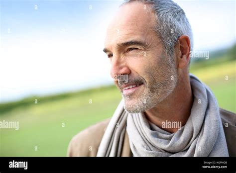 Portrait Of Smiling Mature Handsome Guy Stock Photo Alamy