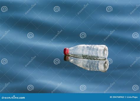 Plastic Bottle Reflected On The Lake Stock Photo Image Of Environment