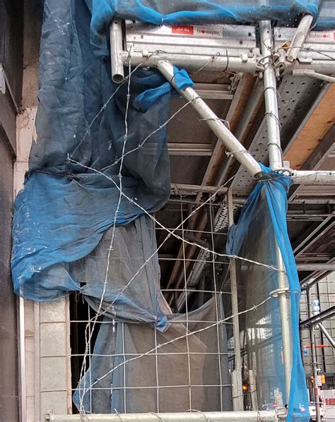 Toronto construction site inexplicably draped in barbed wire is a