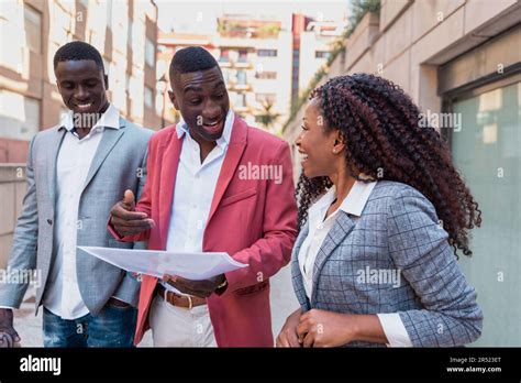 Cheerful African American Male And Female Colleagues In Elegant Outfits