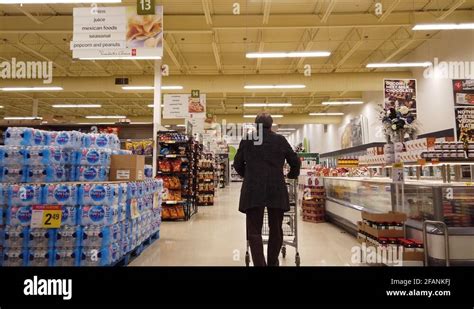 Man Walking Down Grocery Store Aisles Then Turning Into Junk Food Aisle Stock Video Footage - Alamy