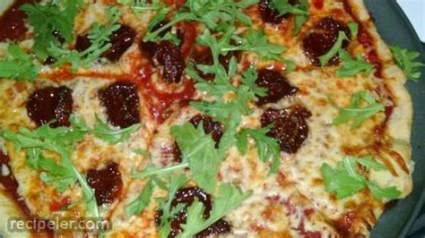 Sun Dried Tomato And Arugula Pizza