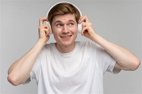 Premium Photo Positive Man Listening To Music Wearing Headset And Dancing