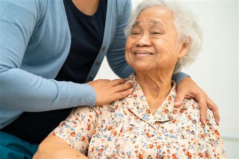 Premium Photo Caregiver Help Asian Elderly Woman Patient With Love