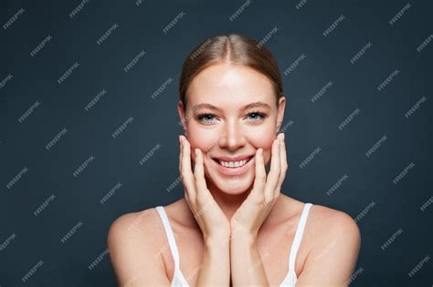 Premium Photo Beautiful Woman Face On Blue Background Happy Woman