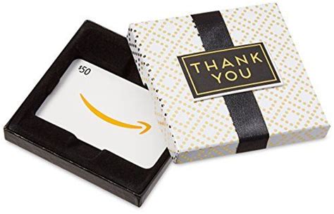 an amazon gift card in a black and white box with a thank you tag on it