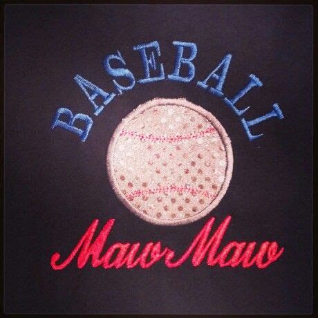 A Close Up Of A Baseball On A Black Shirt