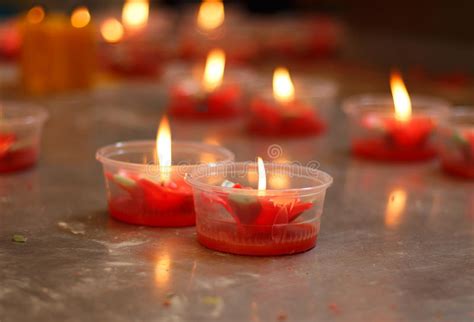 Burning Red Flower Candle At Chinese Shrine For Making Merit In Stock