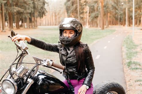 Beautiful Brunette Riding A Motorcycle In The Park Stock Image Image