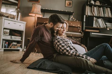 Pregnant Woman With A Husband Sitting On The Floor Stock Image Image