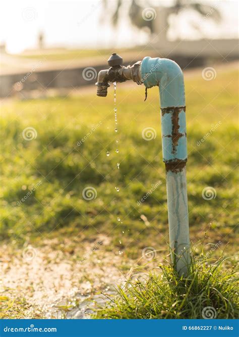 Old and Dirty Brass Water Tap in Nature Stock Image - Image of flowing