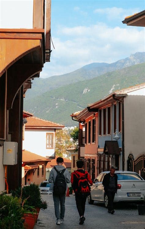 People Walking in a Mountain Town · Free Stock Photo