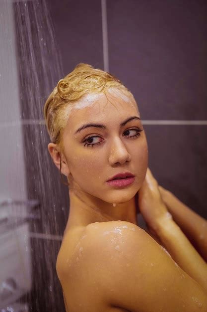 Premium Photo Close Up Of Shirtless Woman Taking Shower In Bathroom