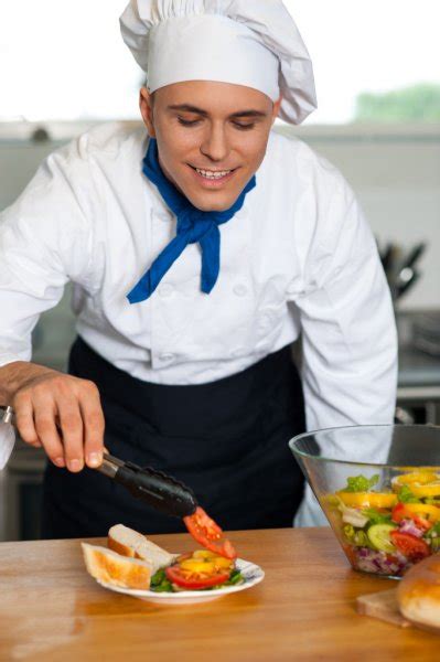 Chef Decorating Pasta Salad With Herbal Leaves Stock Photo By