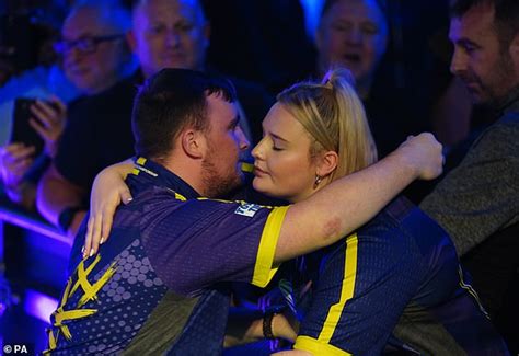 Love match! Darts hero Luke Littler, 16, met girlfriend of six weeks Eloise Milburn, 21, while ...