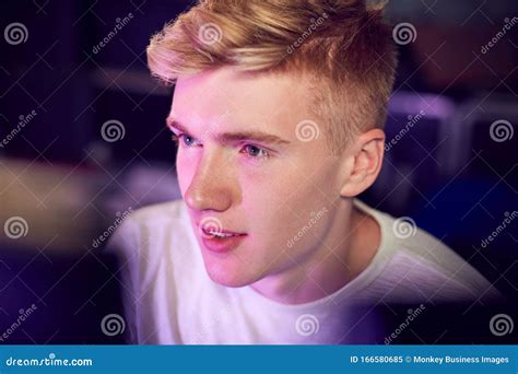 View between Computer Screens of Teenage Boy Gaming at Home Stock Image ...