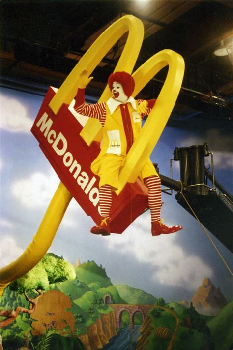 Ronald Mcdonald And His Friends Plant A Small Golden Arch In This