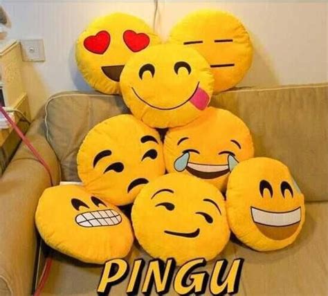 A Group Of Smiley Face Pillows Sitting On Top Of A Couch With The Words