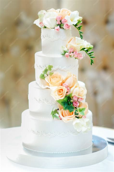 premium photo beautiful multi tiered wedding cake decorated