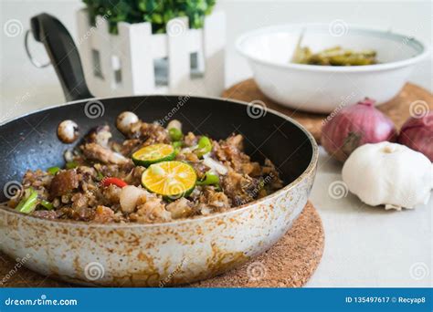 Sizzling Pork Sisig With Raw Egg Royalty-Free Stock Photography ...