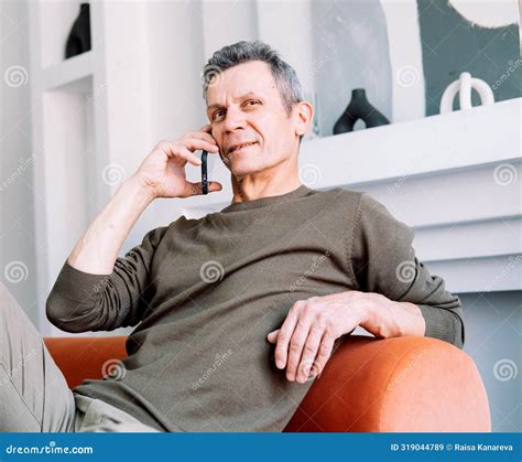 Serious Old Man Talking On Mobile Phone Calling For Emergency